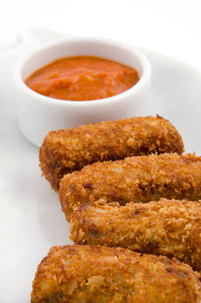 istock vegetable croquettes and sauce on the plate on a white background 1267555854