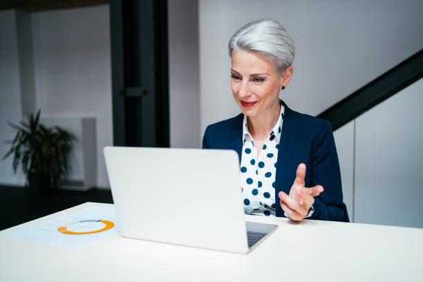 istock Businesswoman meets with colleagues virtually. 1267559924