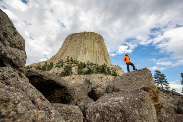 Young men enjoying the view of Devils Tower landscape.