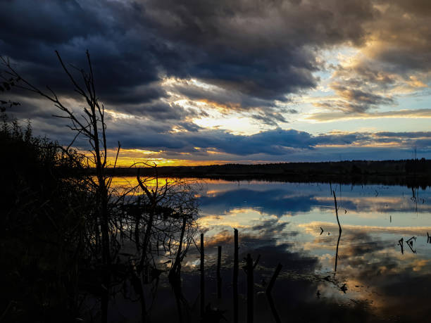 istock Evening sunset with reflection in the water on the lake 1267561647