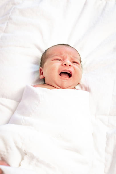 istock Unhappy Newborn baby crying 1267562667