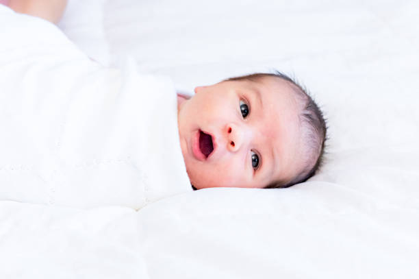 istock Newborn baby boy makes cute face 1267562978