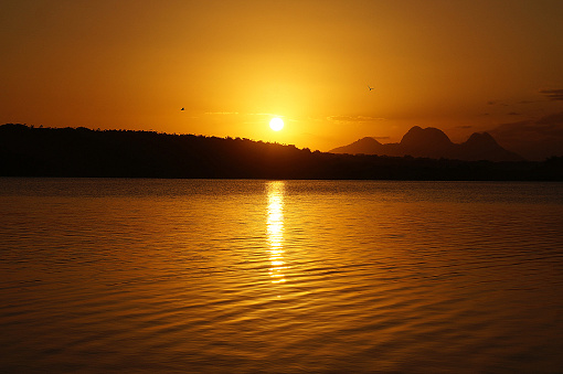 orange sunset lake, imboassica lagoon, macae, rio de janeiro, brazil