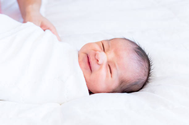 istock Unhappy newborn baby boy 1267563922