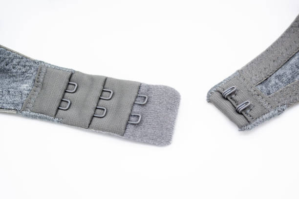 istock Close-up of a grey cotton bra with hooks on a white background 1267564996