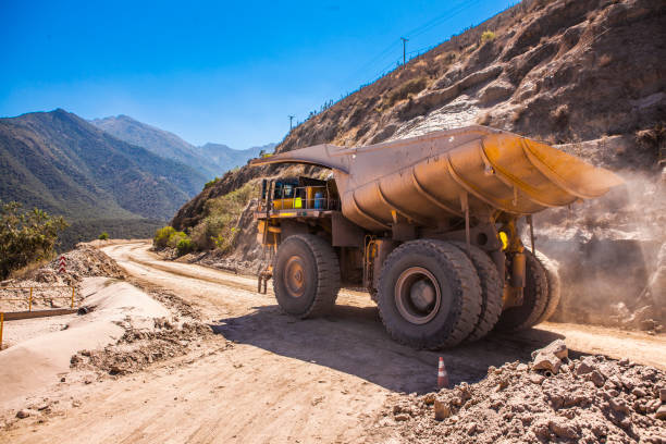 Mining Truck on the road Mining truck transporting rock's load on the dirt road copper mining stock pictures, royalty-free photos & images