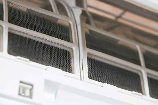 istock repairing air conditioner split system indoors. close up view. diy concept 1267570706