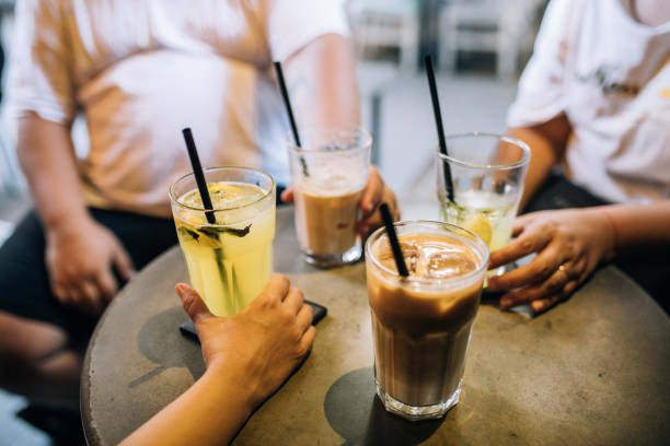 istock Friends drinking lemonade with mint and ice latte on a hot day 1267570808