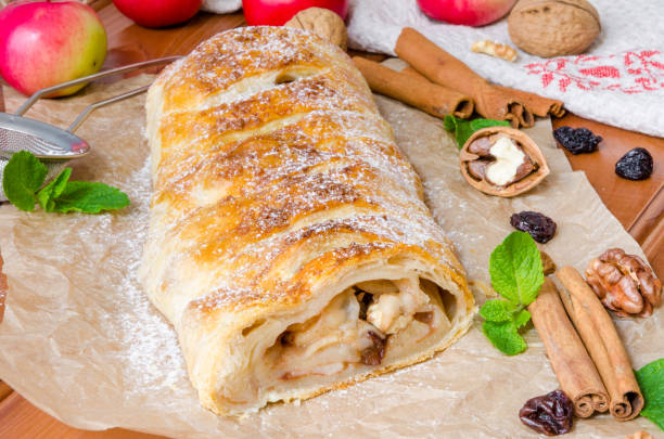 istock Puff pastry strudel with apples , cinnamon , raisins and walnuts. Rustic style. 1267571484