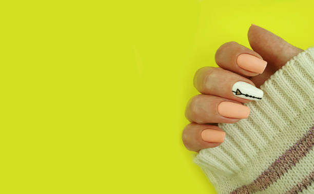 istock female hand beautiful manicure on a colored background 1267571788