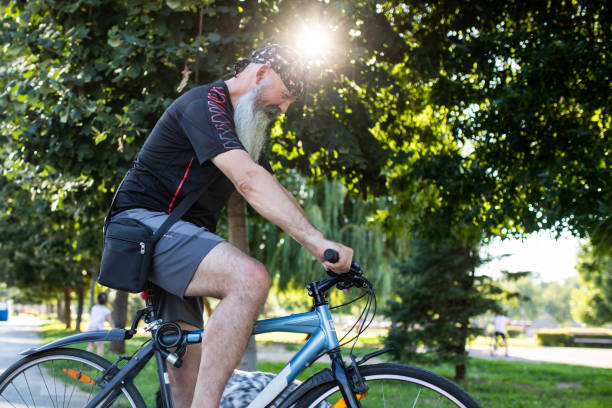 istock A man with a beard looking down at the bike he is sitting on 1267571888