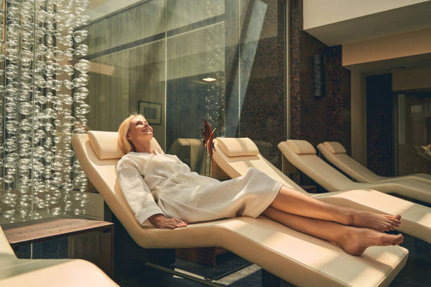 Full length portrait of happy cheerful female relaxing at wellness center after therapy