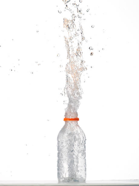 istock Water in glass bottle splashing 1267578438