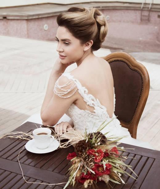 istock Portrait of beautiful bride drinking coffee. 1267579181