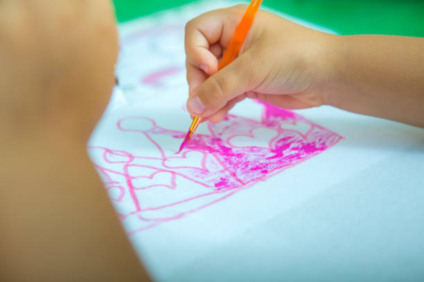 istock Drawing lesson. Children's hands. Children learn to paint. 1267580338