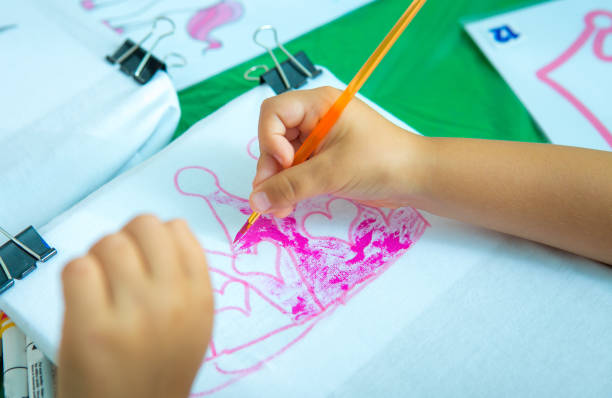 istock Drawing lesson. Children's hands. Children learn to paint. 1267580344