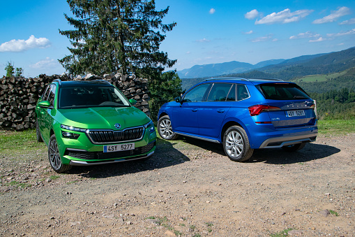 Basel, Switzerland - 26th August, 2019: Skoda Kamiq vehicles stopped on a road in mountain scenery. This model is the smallest SUV/crossover from Skoda (Volkswagen Group).