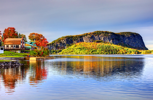 Rockwood, Maine, USA - October 3, 2019: Daytime view of Mt kineo on Moosehead Lake during the autumn foliage season