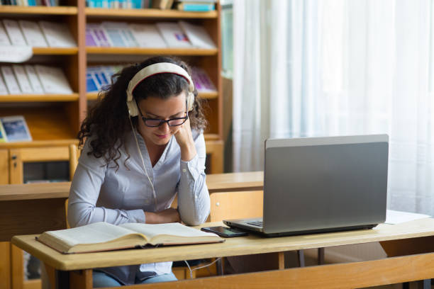 istock Young woman studying in the library 1267590371