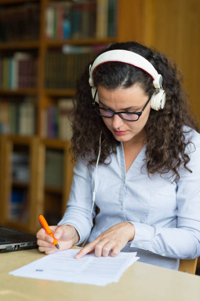 istock Young woman studying in the library 1267590547