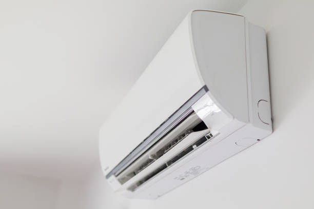 istock Air conditioner on white wall room interior background 1267592223