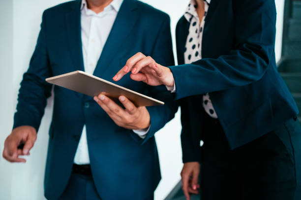istock Business people talking on staircase. 1267593737