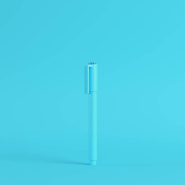 istock Marker pen on bright blue background in pastel colors. Minimalism concept 1267604014