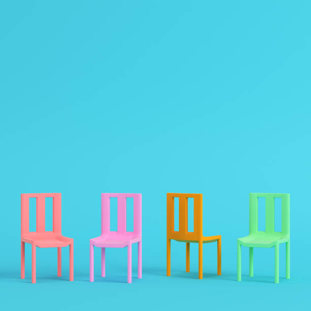 istock Four chairs on bright blue background in pastel colors. Minimalism concept 1267604794