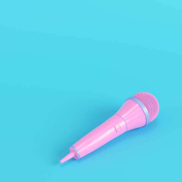 Microphone on bright blue background in pastel colors stock photo