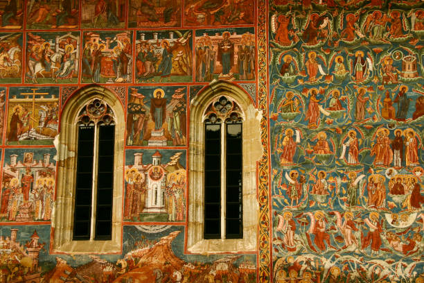 Painted fresco at Annunciation Monastery in Romania Suceava, Romania - Dec 17, 2006: The Annunciation Church is one of the Painted Churches of Moldavia, it was built in 1532. Outer walls of the church are covered in fresco paintings. Far from being mere wall decorations, the paintings form a systematic covering on all the facades and represent complete cycles of religious themes. moldavia photos stock pictures, royalty-free photos & images