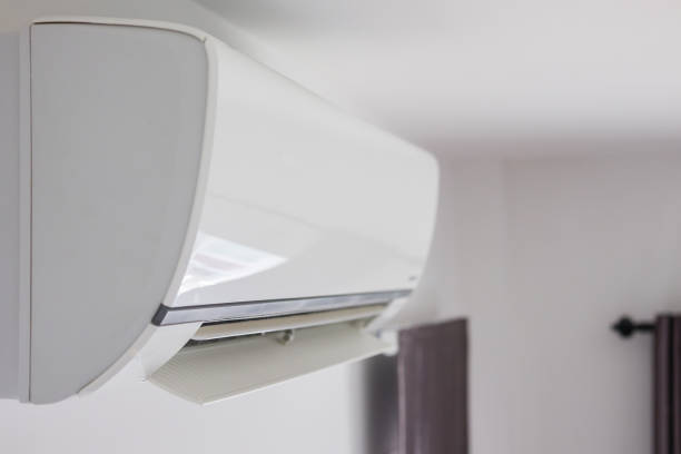 istock Air conditioner on white wall room interior background 1267607215