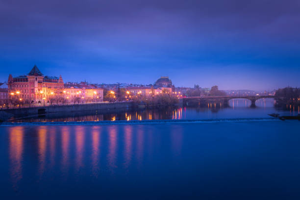 prague panorama with bridges and vltava river at night – czech republic - prague mirrored pattern bridge architecture imagens e fotografias de stock