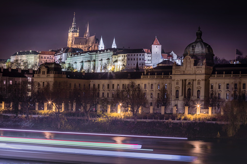 Prague panorama with boat motion and Vltava river at night – Czech Republic