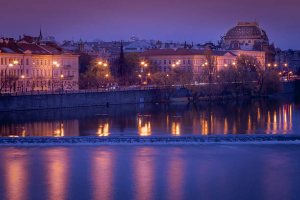 istock Prague panorama with reflection and Vltava river at night – Czech Republic 1267610051