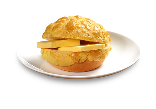 Close up of a typical Cantonese and Hong Kong bread Pineapple Bun with butter (Chinese: Boluobao)