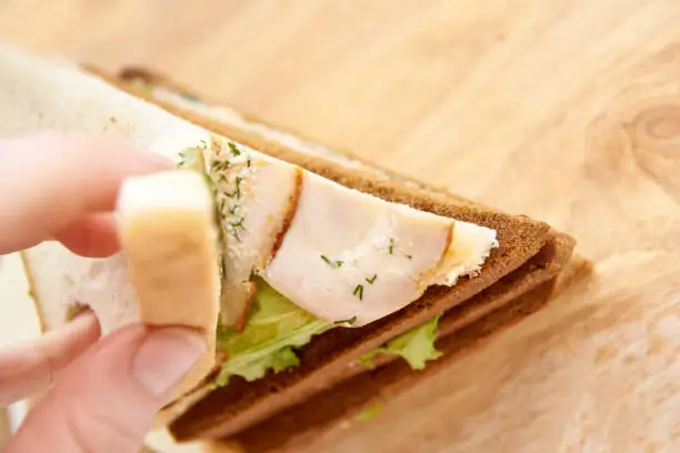 Different bread. Black and white. Sandwich with ham