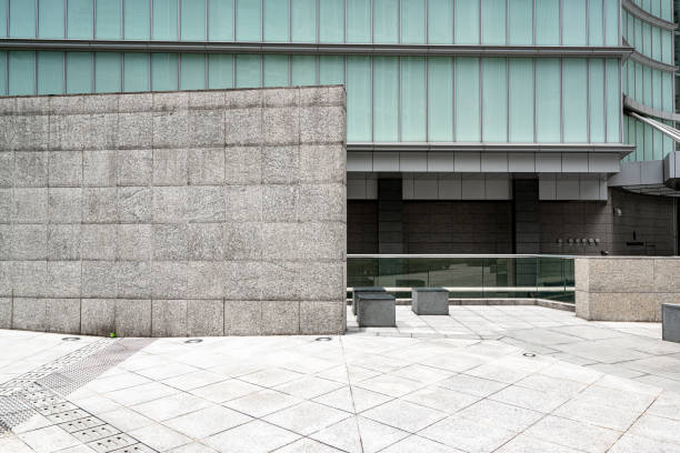 istock White empty brick cracked wall background on sidewalk of city 1267620609