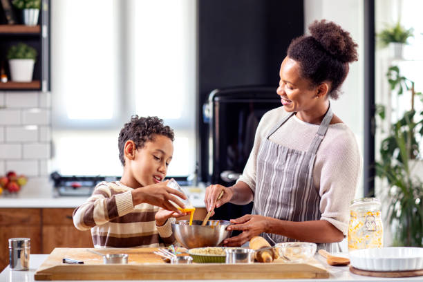istock Mother with his son prepare pie in the kitchen 1267622331