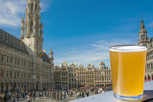 Glass of light beer at Grand Place (Grote Markt) in Brussels, Belgium.