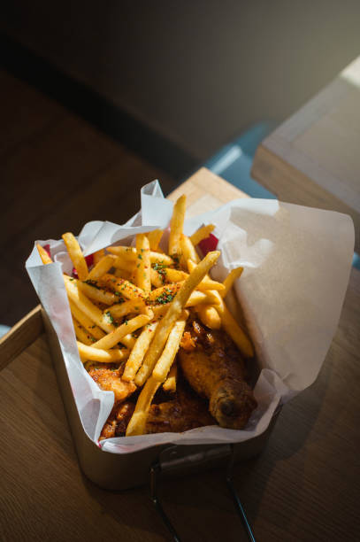 istock Serving of crispy fried chicken with chips 1267625517