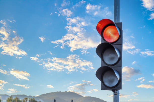 istock Candid photo of traffic light over a dramatic sky. Copy space for text. 1267625701