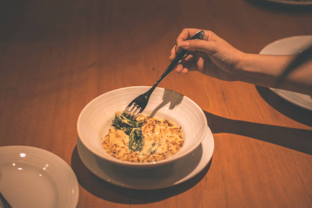 istock People use fork for pick Spinach cheese in the dish in the restaurant. 1267626706