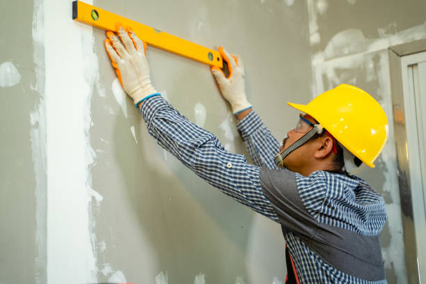 istock Construction worker uses to measure the level in house. 1267627680