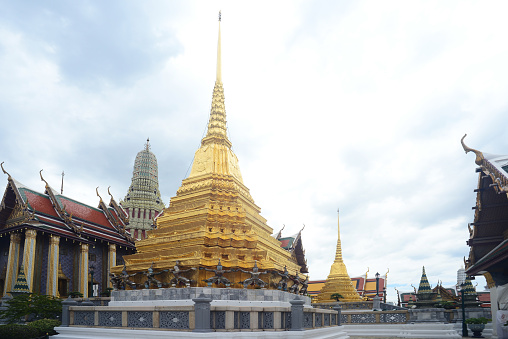 Two gilt chedis Part of Wat Phra Kaew no people, in the time of Corona Virus Disease (COVID-19) Bangkok, Thailand