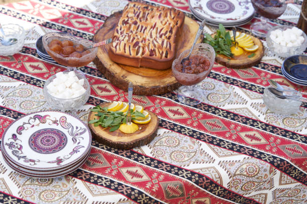 istock Breakfast table with apple pie, tea glass, outdoors. Homemade Apple Pie 1267629236