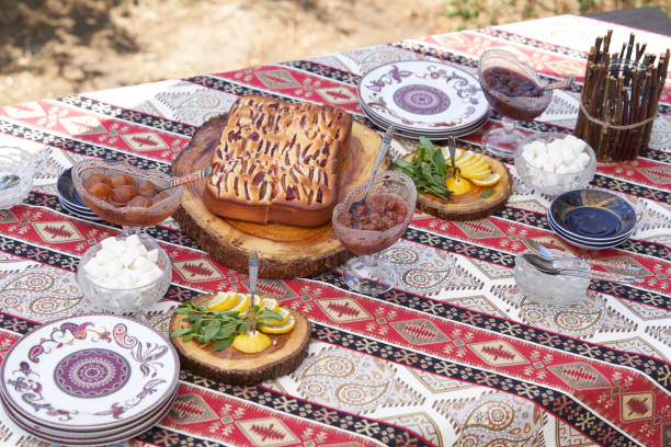 istock Breakfast table with apple pie, tea glass, outdoors. Homemade Apple Pie 1267629239