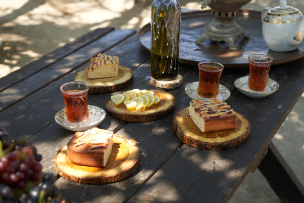 istock Breakfast table with apple pie, tea glass, outdoors. Homemade Apple Pie 1267629317