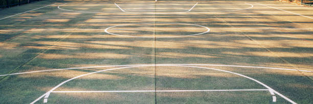 white mark lines on public sport playground with daylight shadows outdoor
