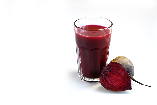 Beet juice. Fresh beetroot in a glass on a white background of isolate. Close up. Fresh-squeezed juice beetroot. Healthy drink