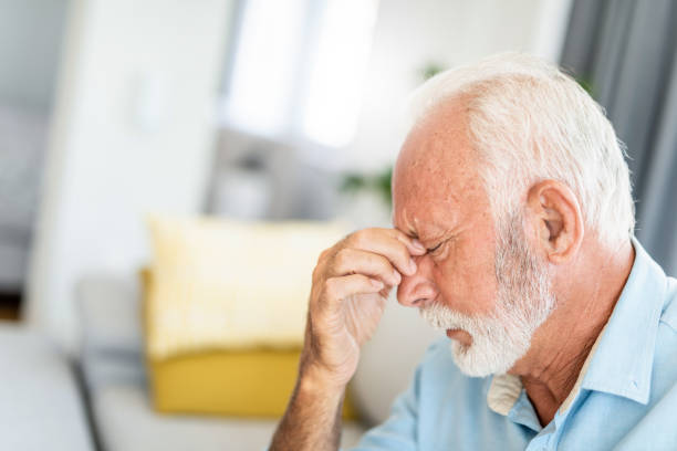 istock Close-up of senior man having headache. 1267632609